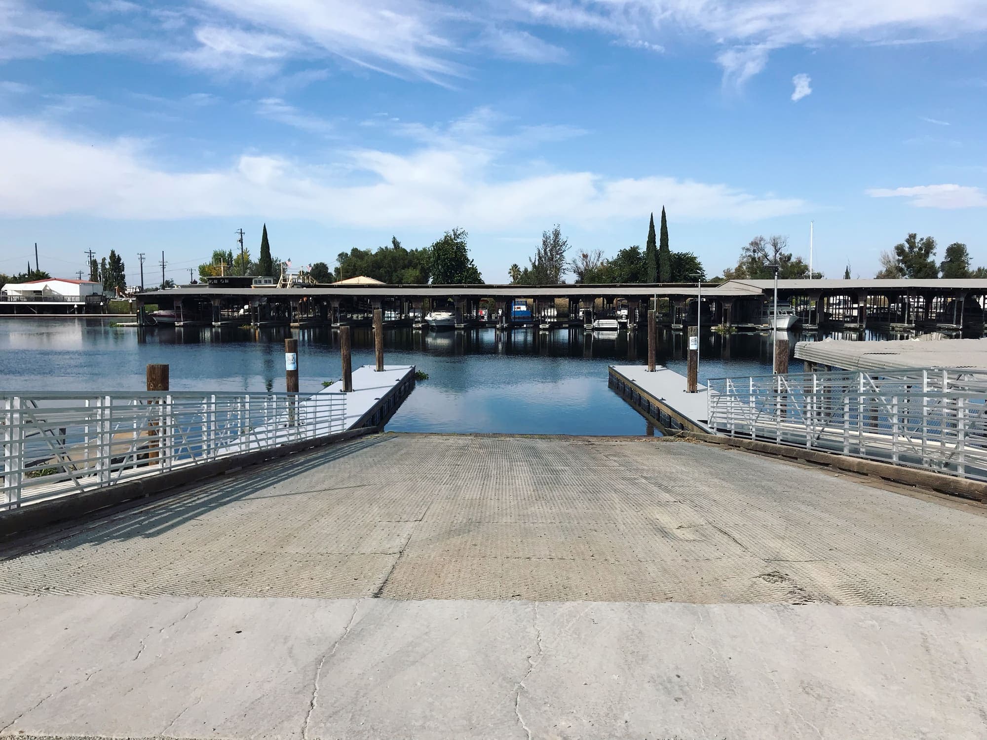 The launch ramp at Sunset Harbor, a dock on each side, looking out across the water